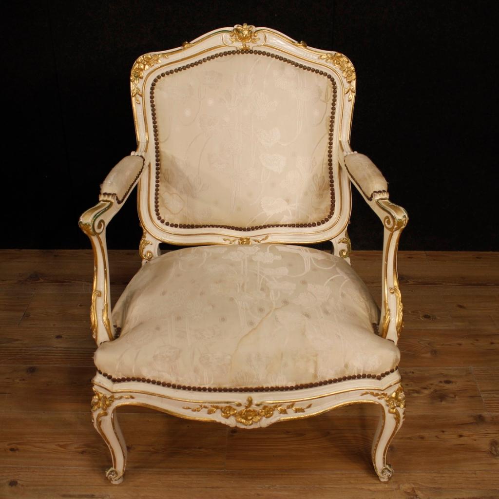 Pair of French armchairs of the 20th century. Richly carved wooden furniture lacquered is gold of good size and great impact. Armchairs for lounge or lounge of good comfort with padding in good condition. Seat height of 41 cm. Armchairs upholstered
