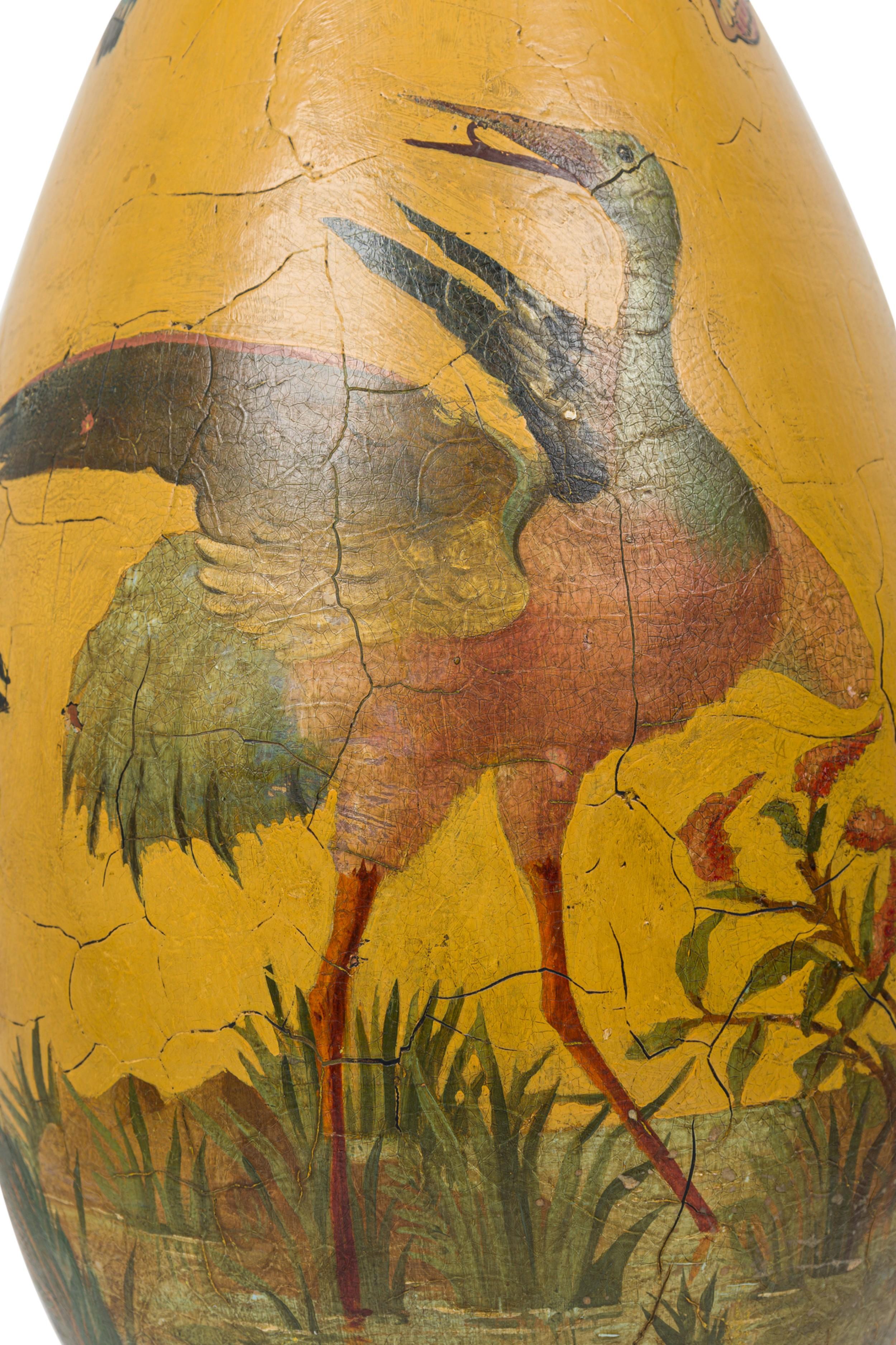 Pair of French (19th Century) glazed terra-cotta urns having flared scalloped tops and painted with a scene featuring birds and butterflies against a yellow background (SIGNED) (PRICED AS Pair)

Pedestals: 13.5