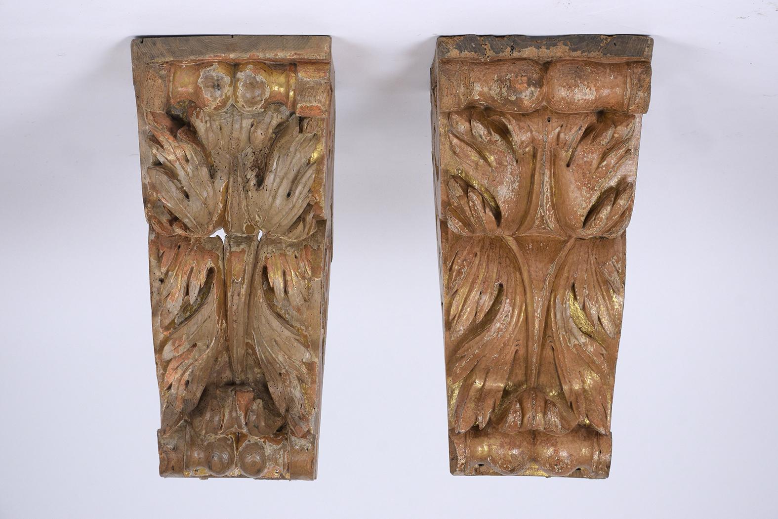 This pair of late 18th century Louis XVI Corbels are in good condition, made out of solid wood, and have their original paint with a distressed finish. These wall sconces are hand-carved, handcrafted, and ready to be used for years to come.