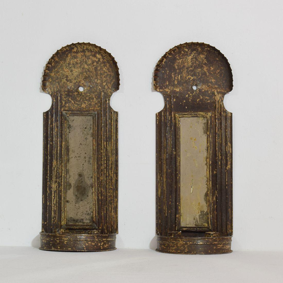 Unique pair of iron wall candleholders with small mirrors that reflect the light.
France circa 1750-1800
Weathered, small losses.