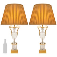 pair of French late 19th century Charles X st. Crystal and Ormolu lamps
