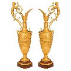Pair of French late 19th century Renaissance st. Ormolu and marble ewers
