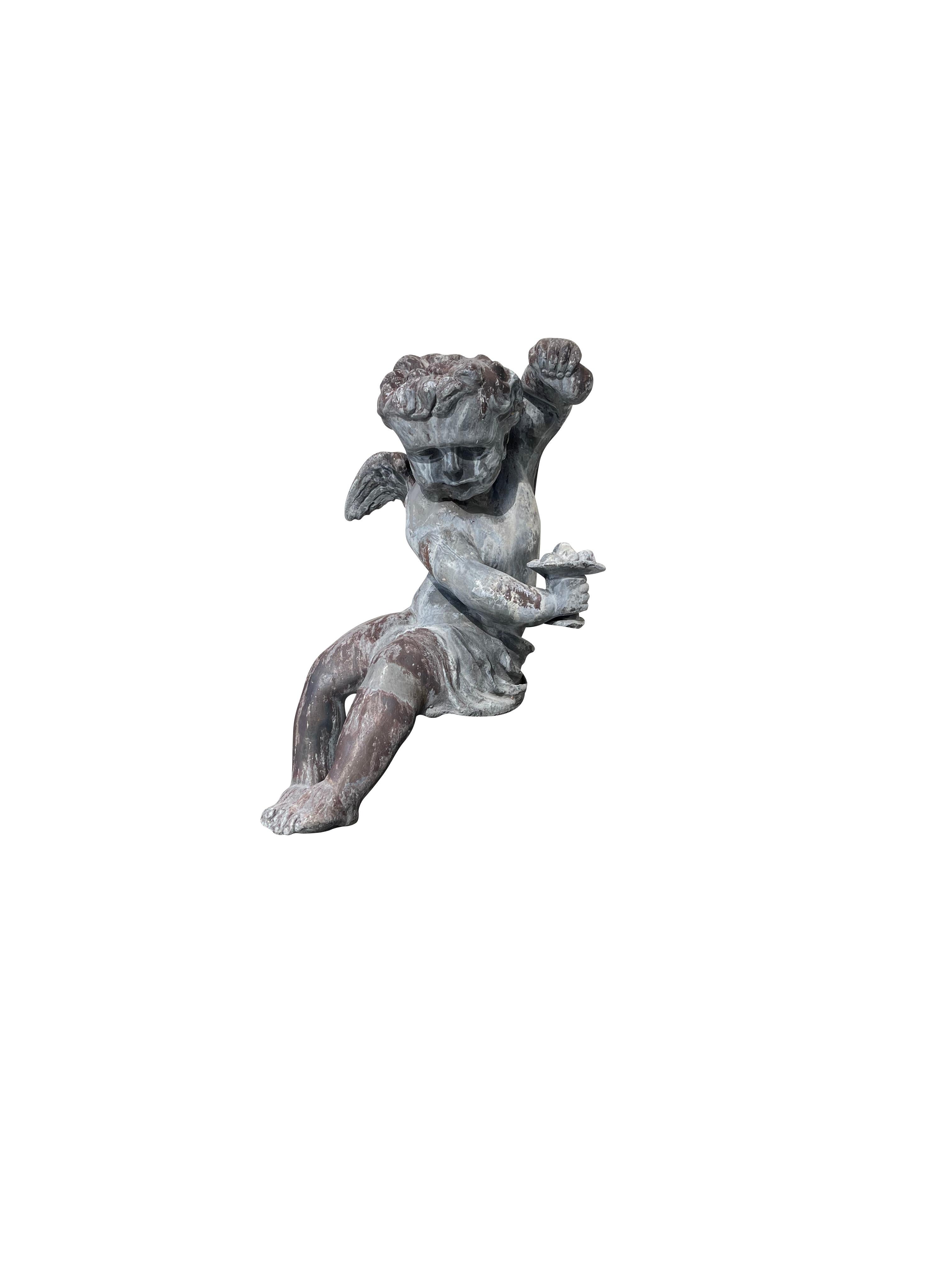 Pair of French Lead Bacchus Putti Seated Garden Figures In Good Condition For Sale In Essex, MA