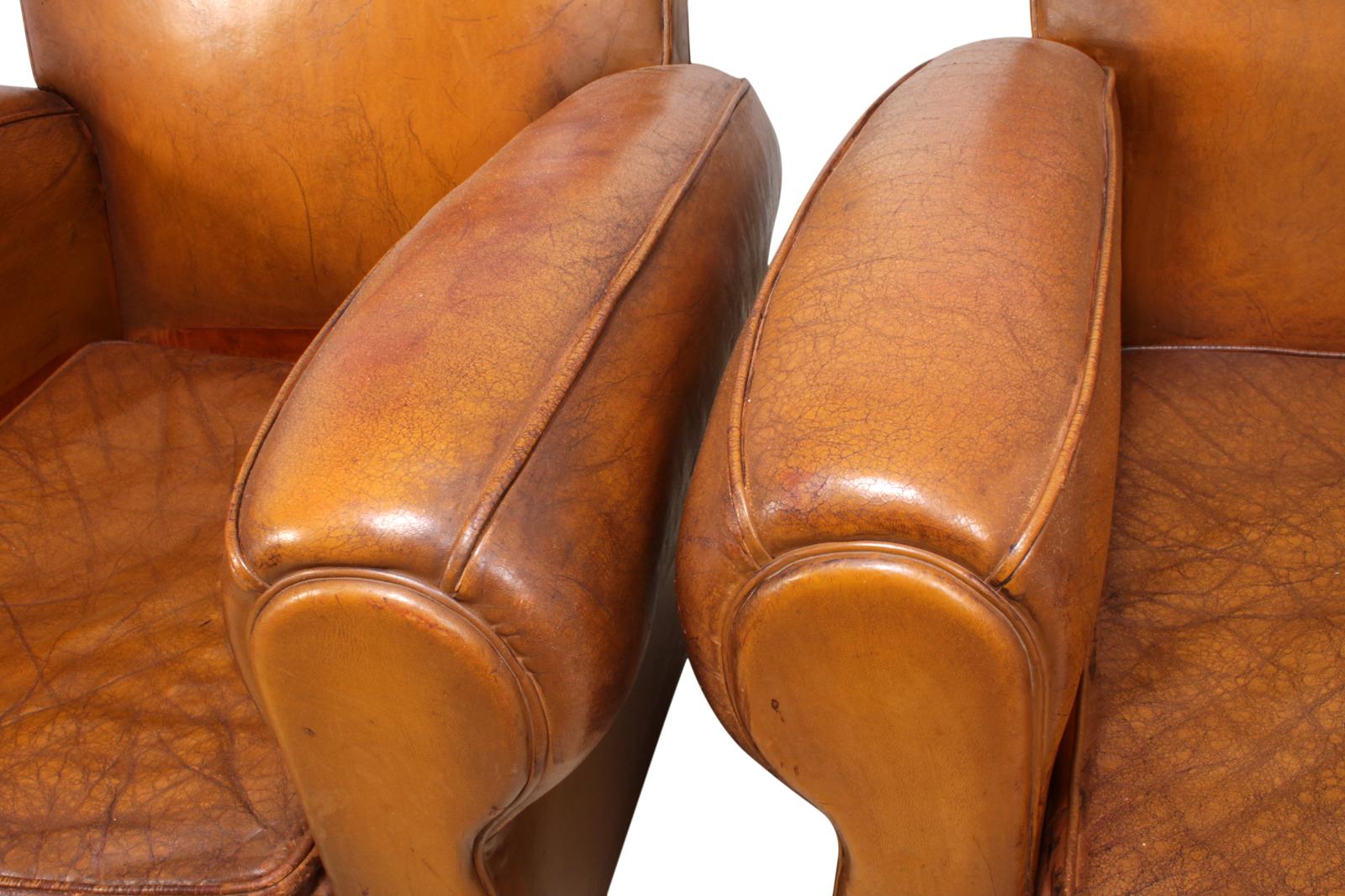 Pair of French leather club chairs, circa 1940.
This pair of leather club chairs are in good condition for there age we have conditioned and fed the leather to enhance its durability and strength, they are coil sprung on a solid hardwood