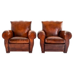 Pair of French Leather Club Chairs with Moustache Backs