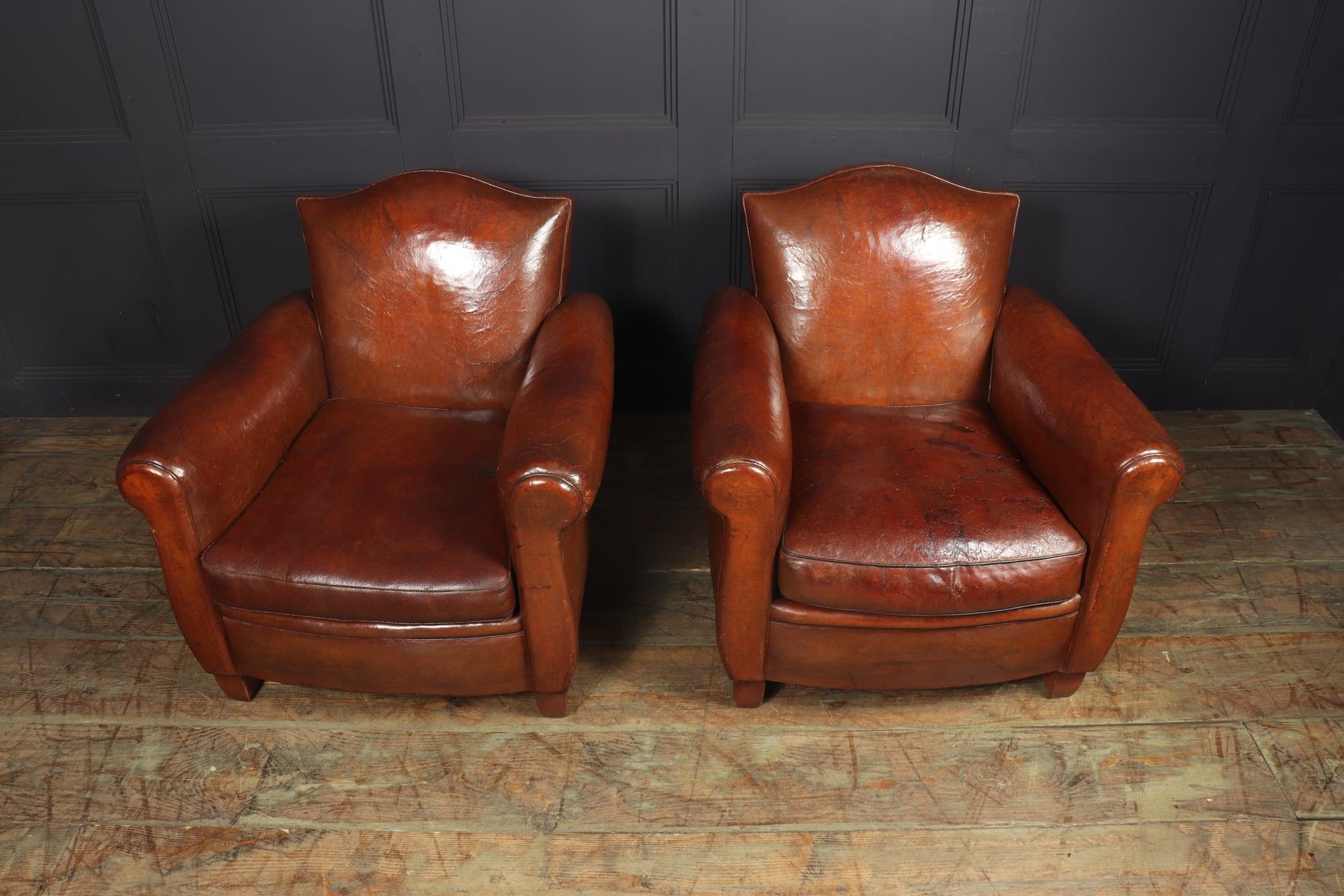 A lovely pair of original French leather camel back club chairs in very well preserved condition with light restoration and full leather treatment the chairs have great patina on a chestnut brown leather

Age: 1930

Style: French

Material: