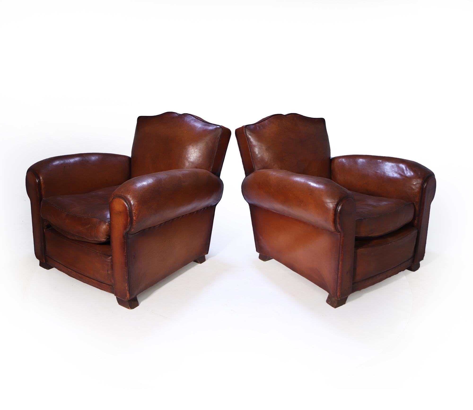 A stunning pair of original 1930’s leather club chairs that have been extremely well preserved, thick soft leather that has been treated softened and polished, the leather does have a few cracks and small repairs and imperfections this is all adding