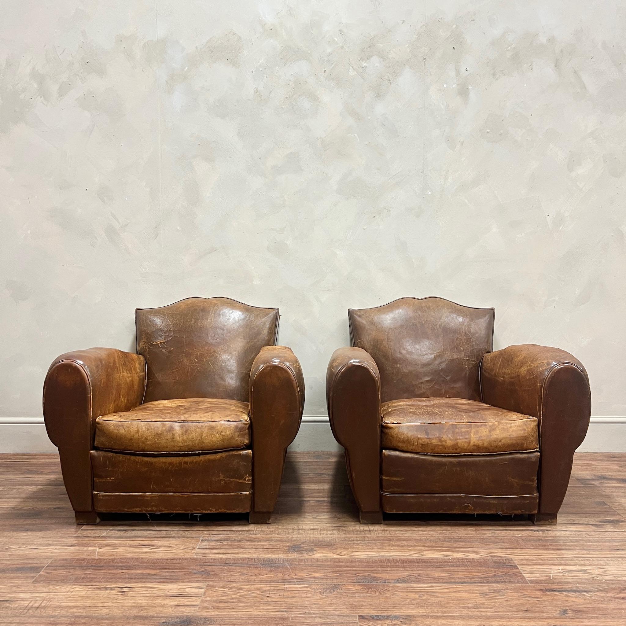 One of the most desirable models of leather club chairs, which are getting harder to find in good condition.
A pair of French, leather moustache back club chairs; lovely worn-in leather on comfortable frames.
We have had the webbing re-done on both