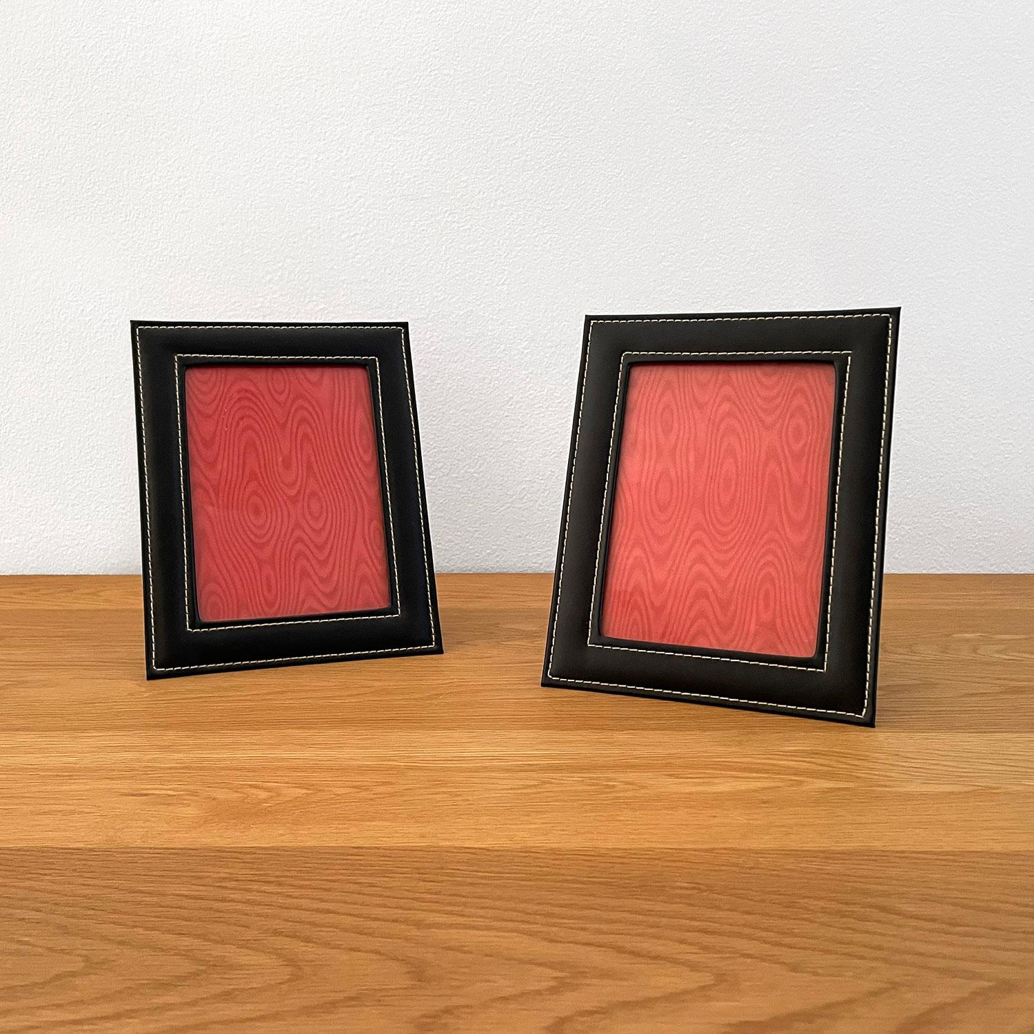 Pair of French leather picture frames in the style of Jacques Adnet.
France, circa 1950’s.
Rich black leather with contrast stitching.
Light surface markings.
In good vintage condition.