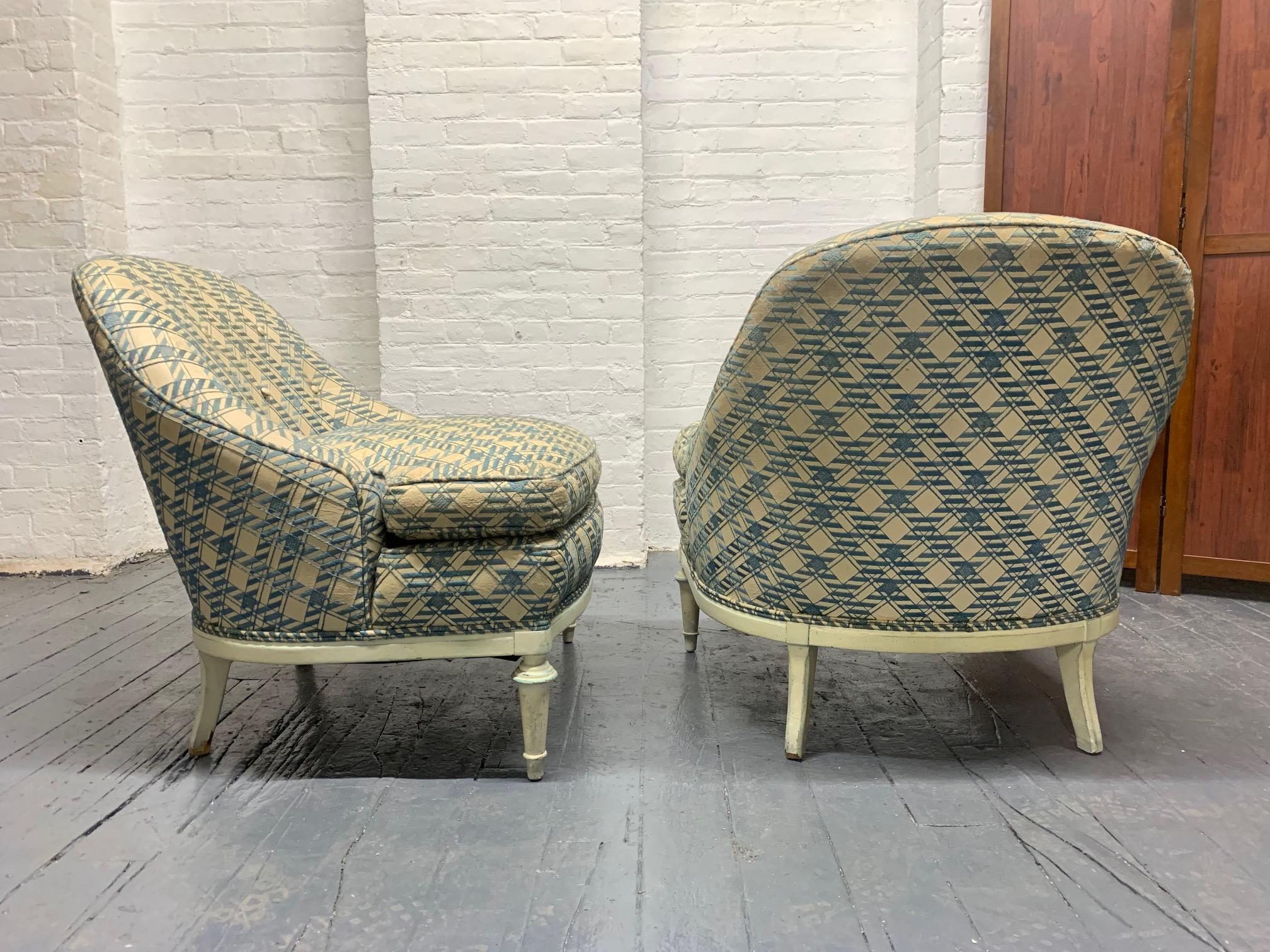 Pair of French leather slipper chairs with a painted wood base. Has loose cushioned seats.