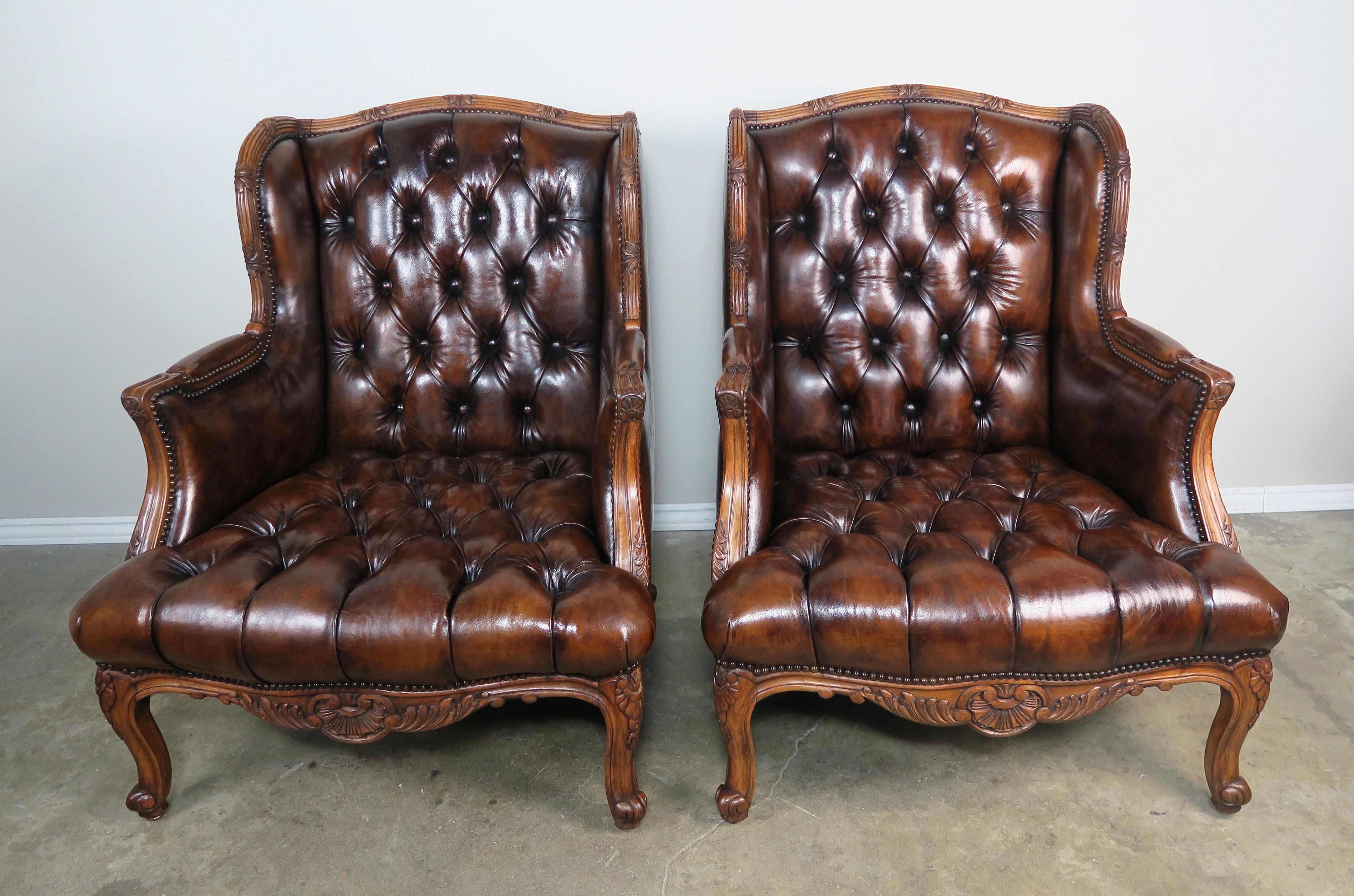Pair of French Leather Tufted Armchairs with Matching Ottomans In Distressed Condition In Los Angeles, CA