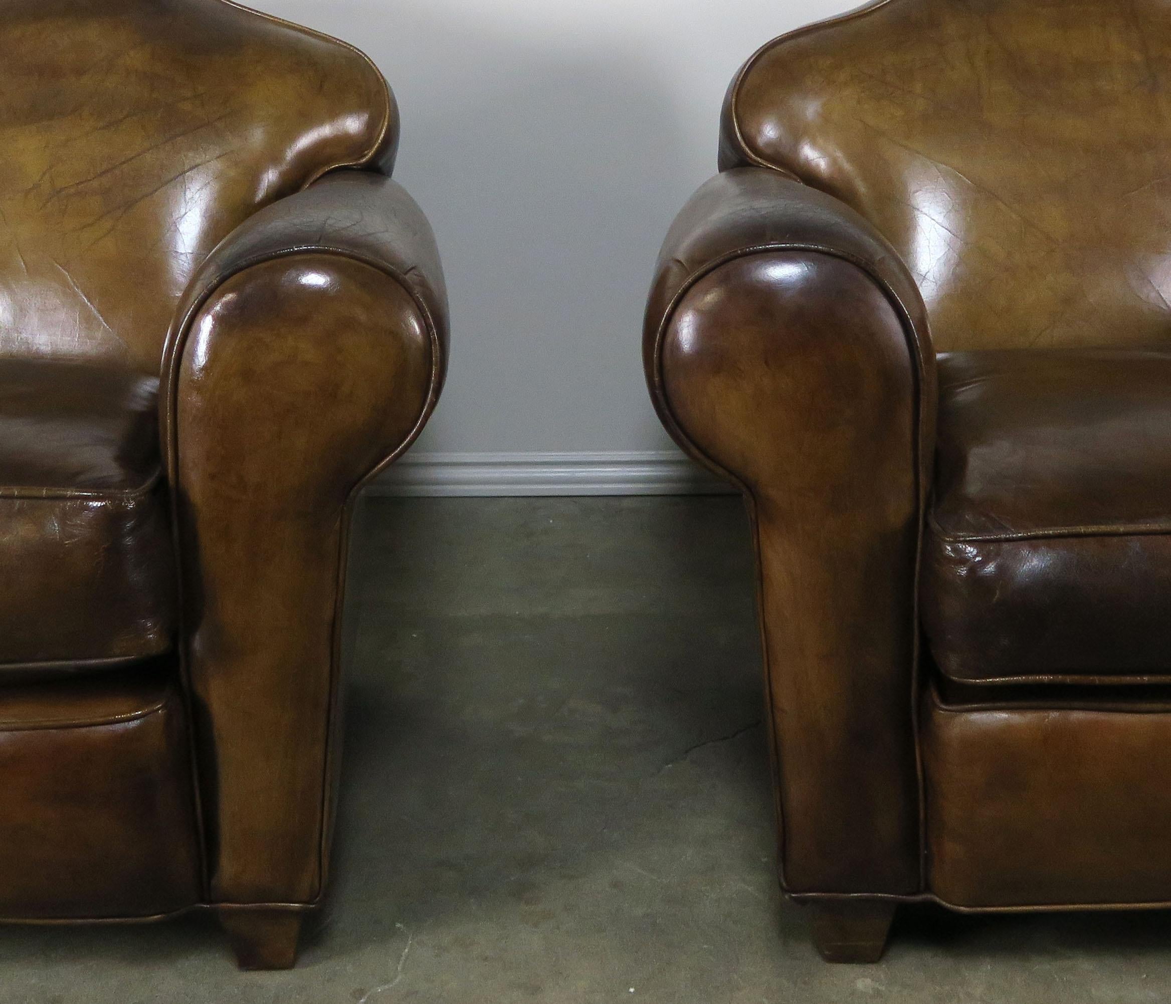 Pair of French Leather Upholstered Club Chairs, circa 1940s In Distressed Condition In Los Angeles, CA