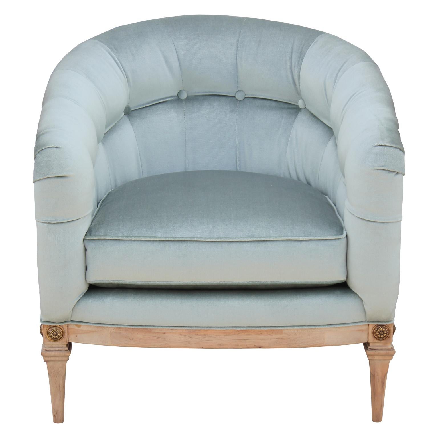 Pair of gorgeous French barrel back lounge chairs freshly upholstered in a light blue velvet, with a neutral finish and brass accents.