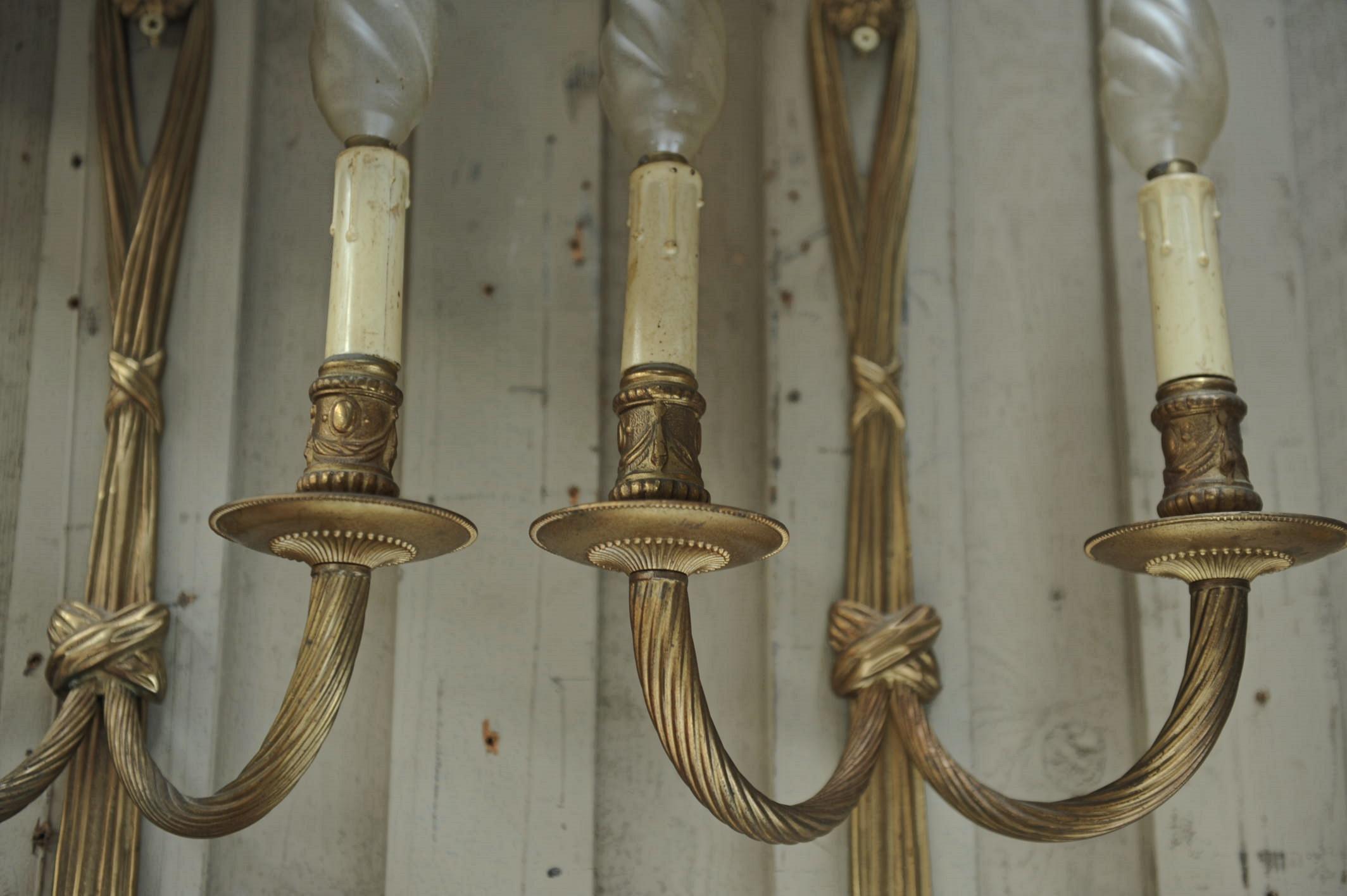Pair of French Louis XVI style bronze wall sconces circa 1920 very good condition.