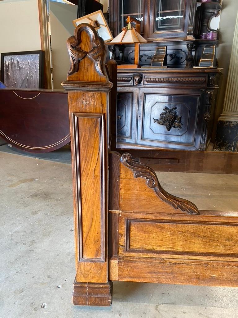 Pair of Louis Philippe French Burl Walnut Daybeds. Leafy garlands and articulated lines. Detailing on one post could be restored by Kipper Designs upon request. 

fine craftsmanship and beautiful detailing. 

Exterior Measurements: 83