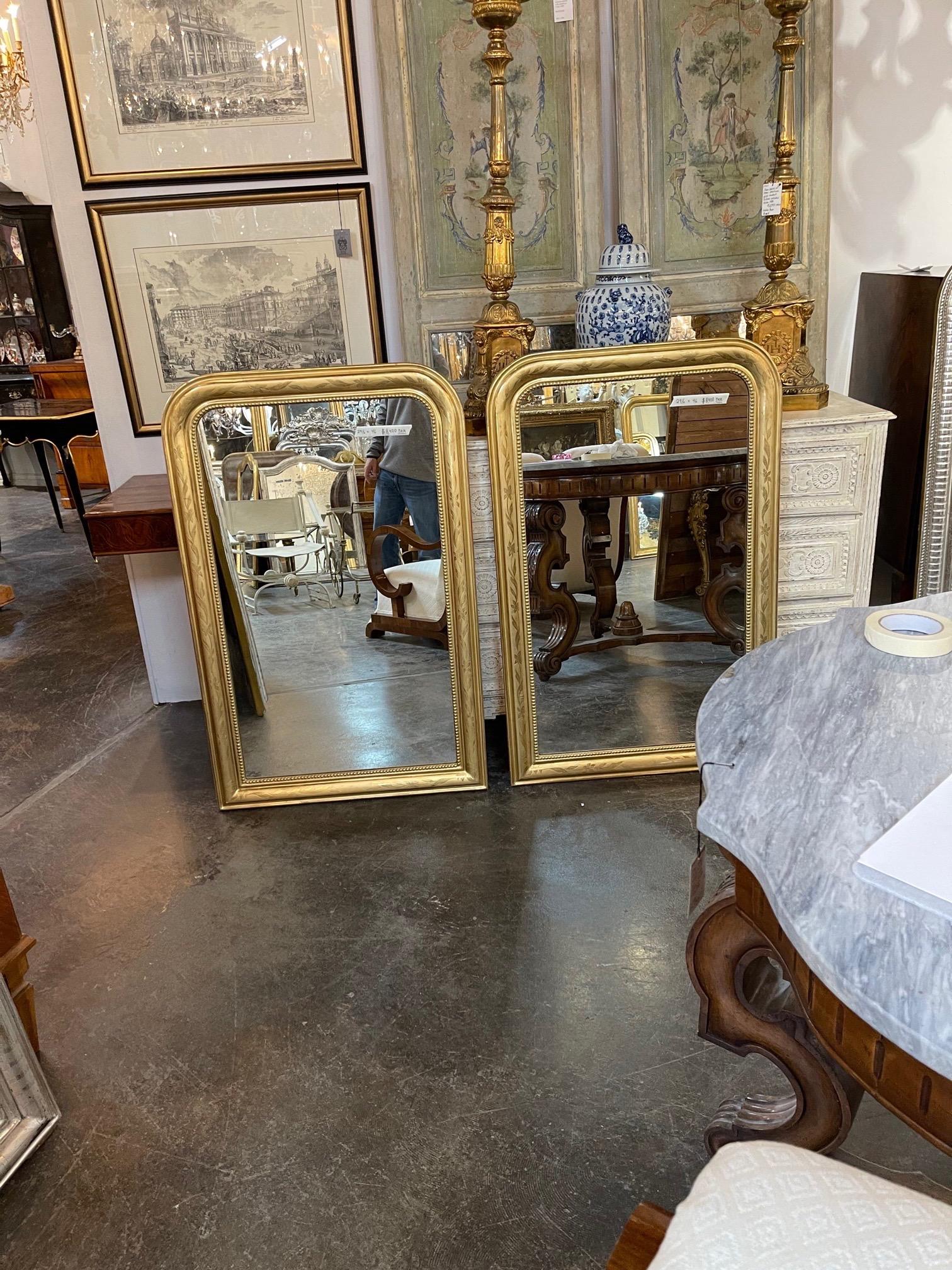 Exceptional pair of French Louis Philippe gold leaf mirrors. Note the pretty floral pattern along with the beaded inside border. Fabulous!!