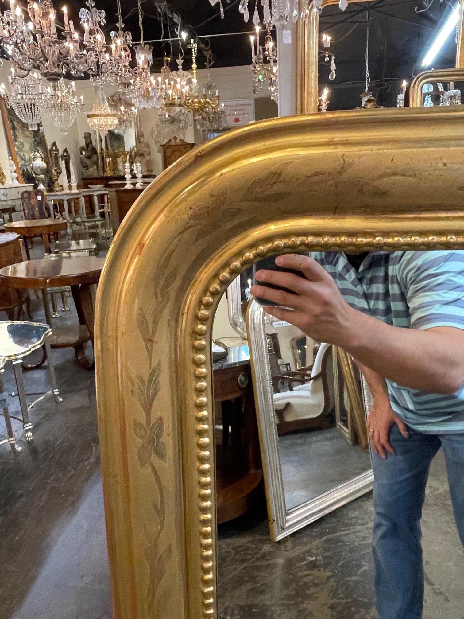 Fine pair of French Louis Philippe gold leaf mirrors. There is a pretty floral pattern on these along with a beaded inside border. Very special!