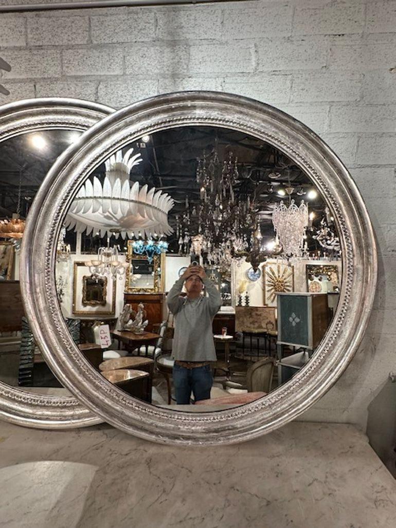 Pair of French Louis Philippe large scale silver leaf round mirrors. Circa 2000. A favorite of top designers!