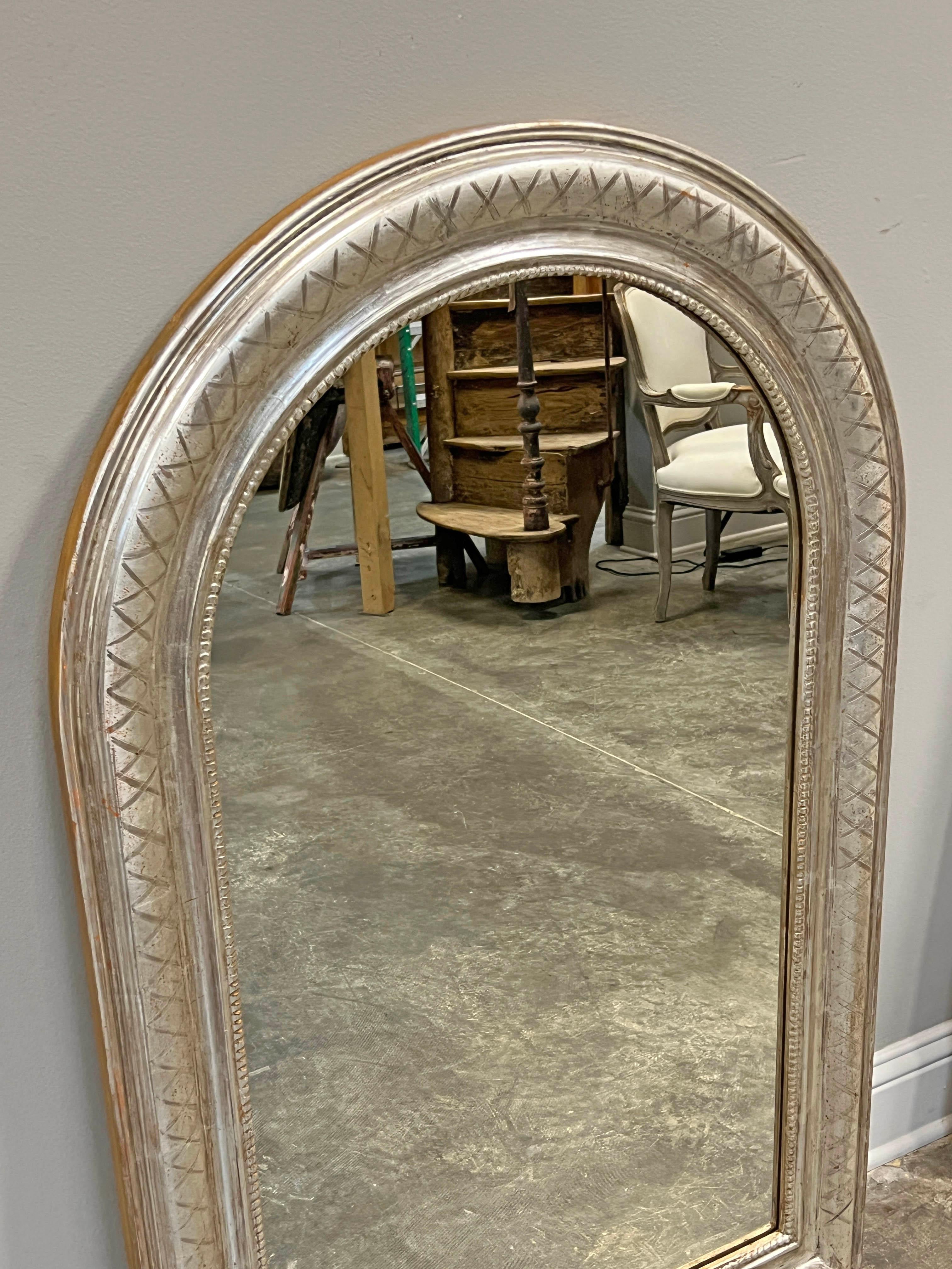 Pair of Louis Philippe style silver gilt mirrors, trellis design on frame with beading along inside of frame. Great for a pair of sinks, commodes or consoles!