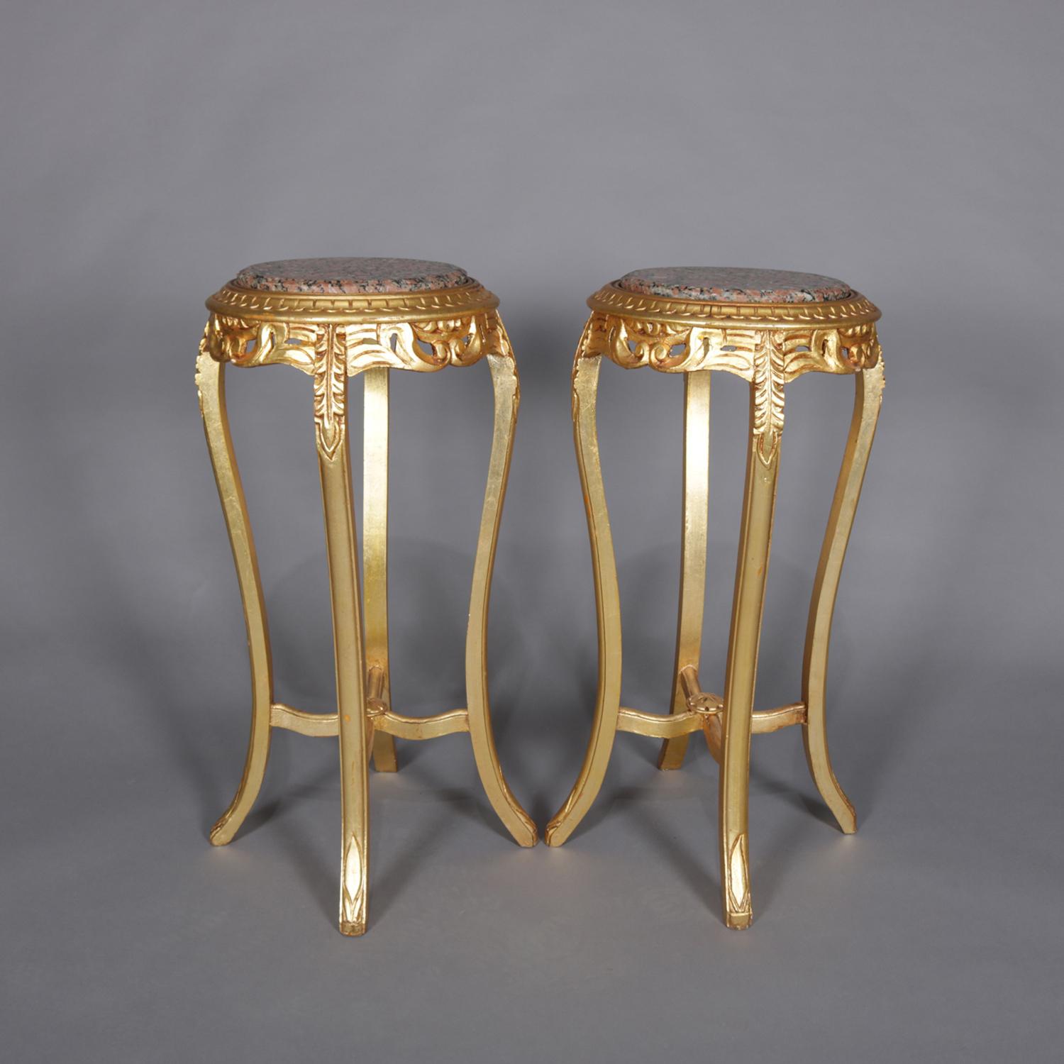 A pair of French Louis XIV sculpture pedestals feature round marble displays surmounting giltwood frames having pierced scroll and foliate apron and raised on cabriole legs with acanthus carving , 20th century

Measures: 34