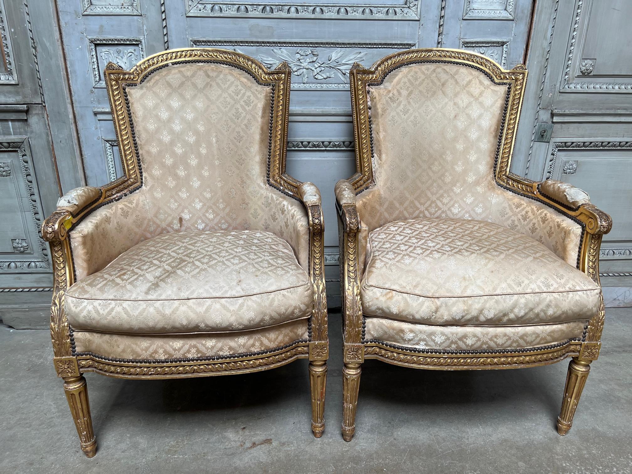 Carved Pair of French Louis XIV Style Gilt Wood Bergeres For Sale