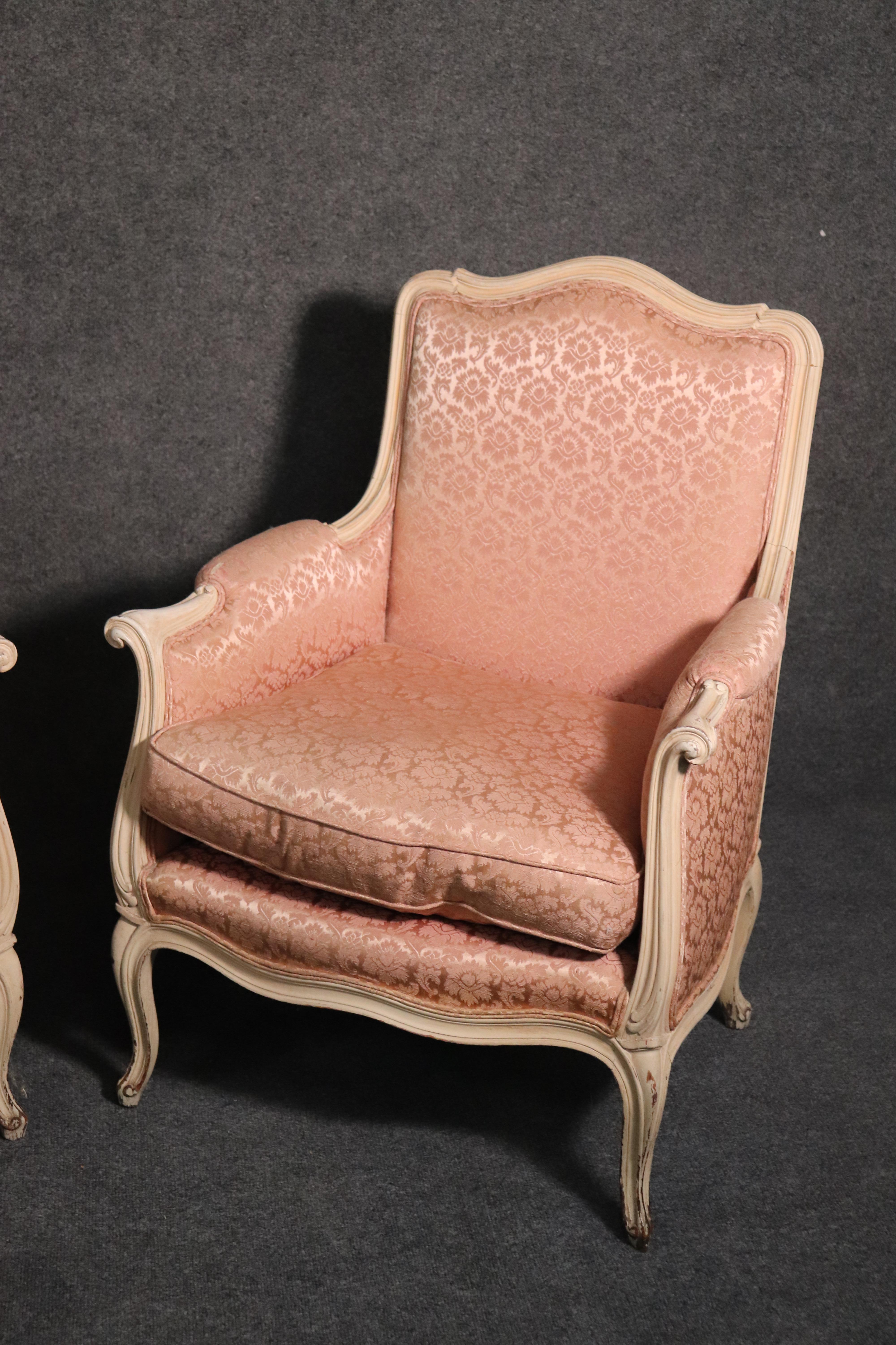 American Pair of French Louis XV Crème Painted Bergère Lounge Chairs with Pink Damask