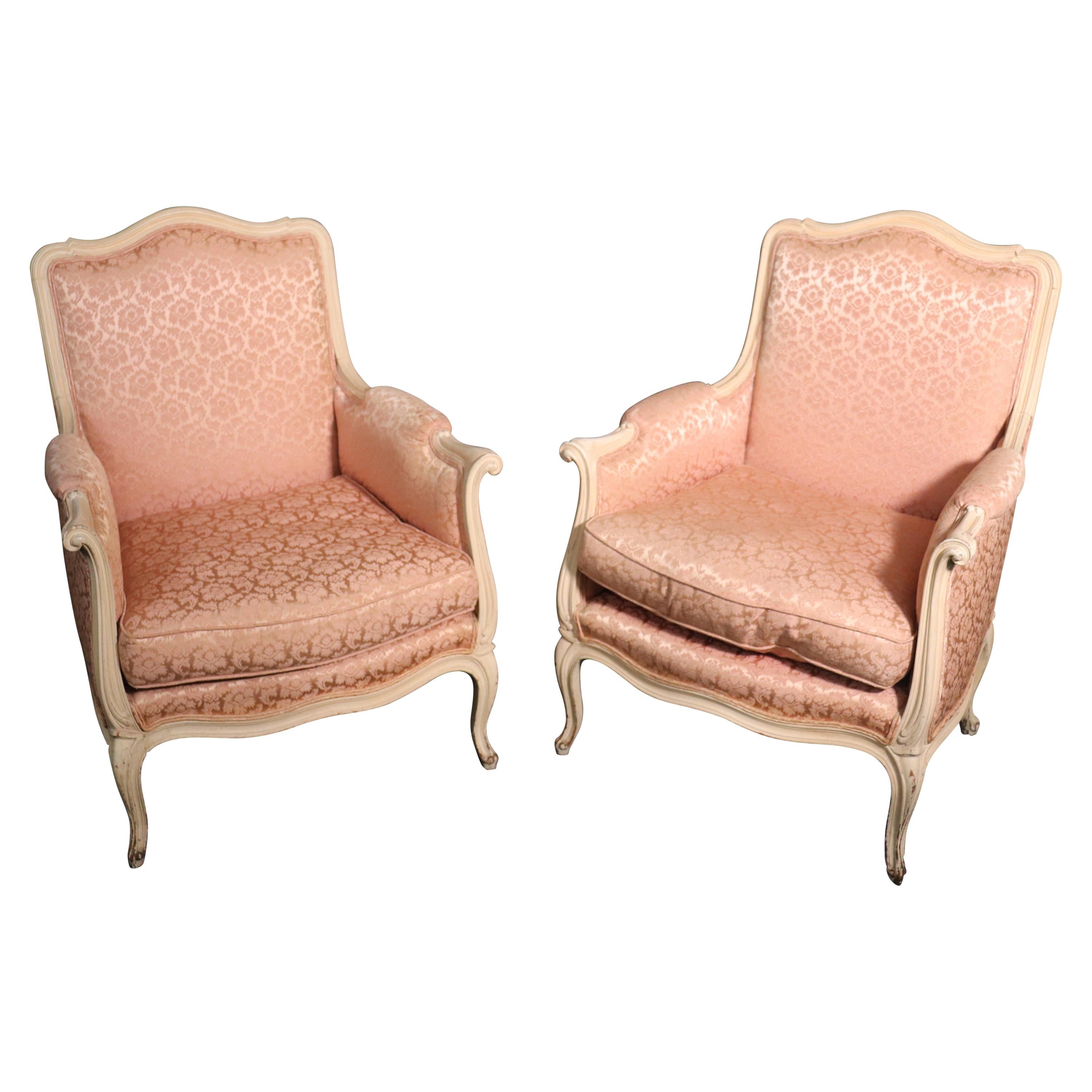 Pair of French Louis XV Crème Painted Bergère Lounge Chairs with Pink Damask