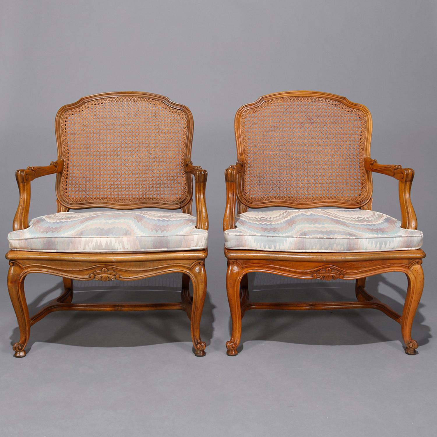Carved Pair of French Louis XV Fruitwood Pressed Cane Arm Chairs, 19th Century