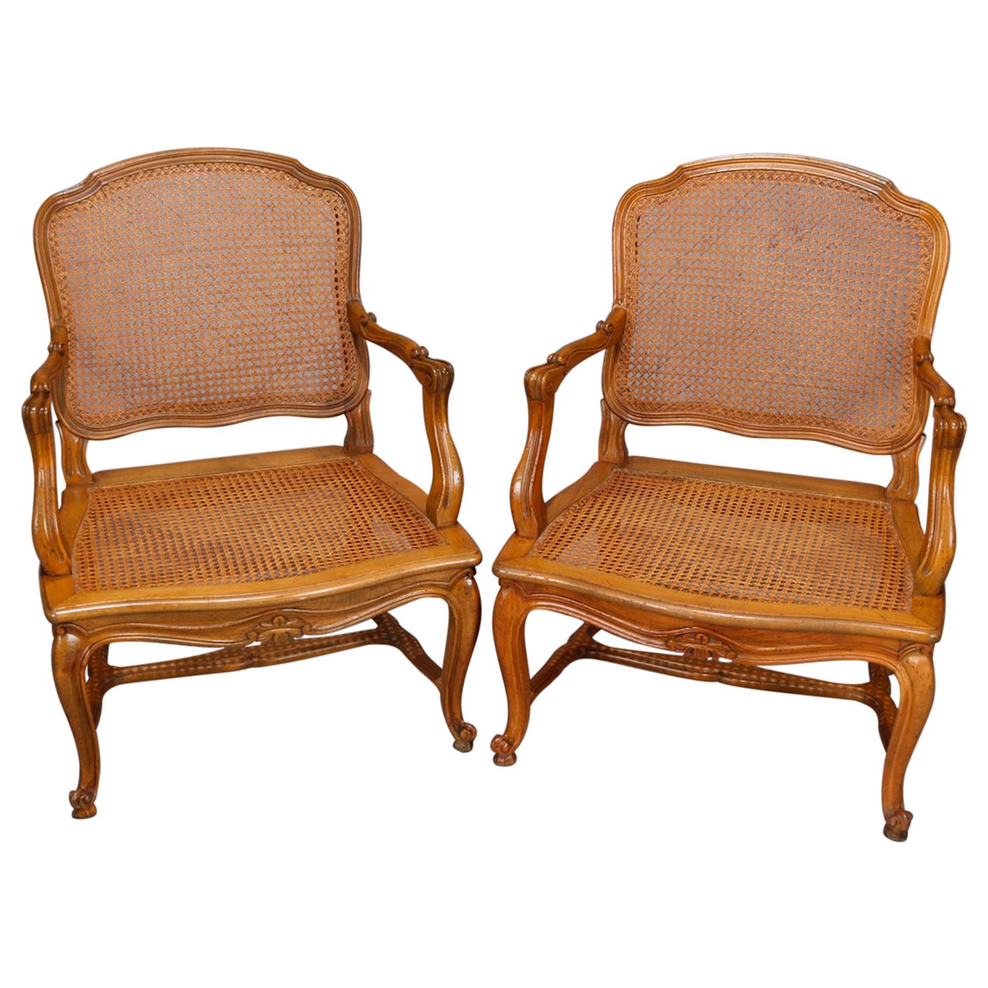 Pair of French Louis XV Fruitwood Pressed Cane Arm Chairs, 19th Century