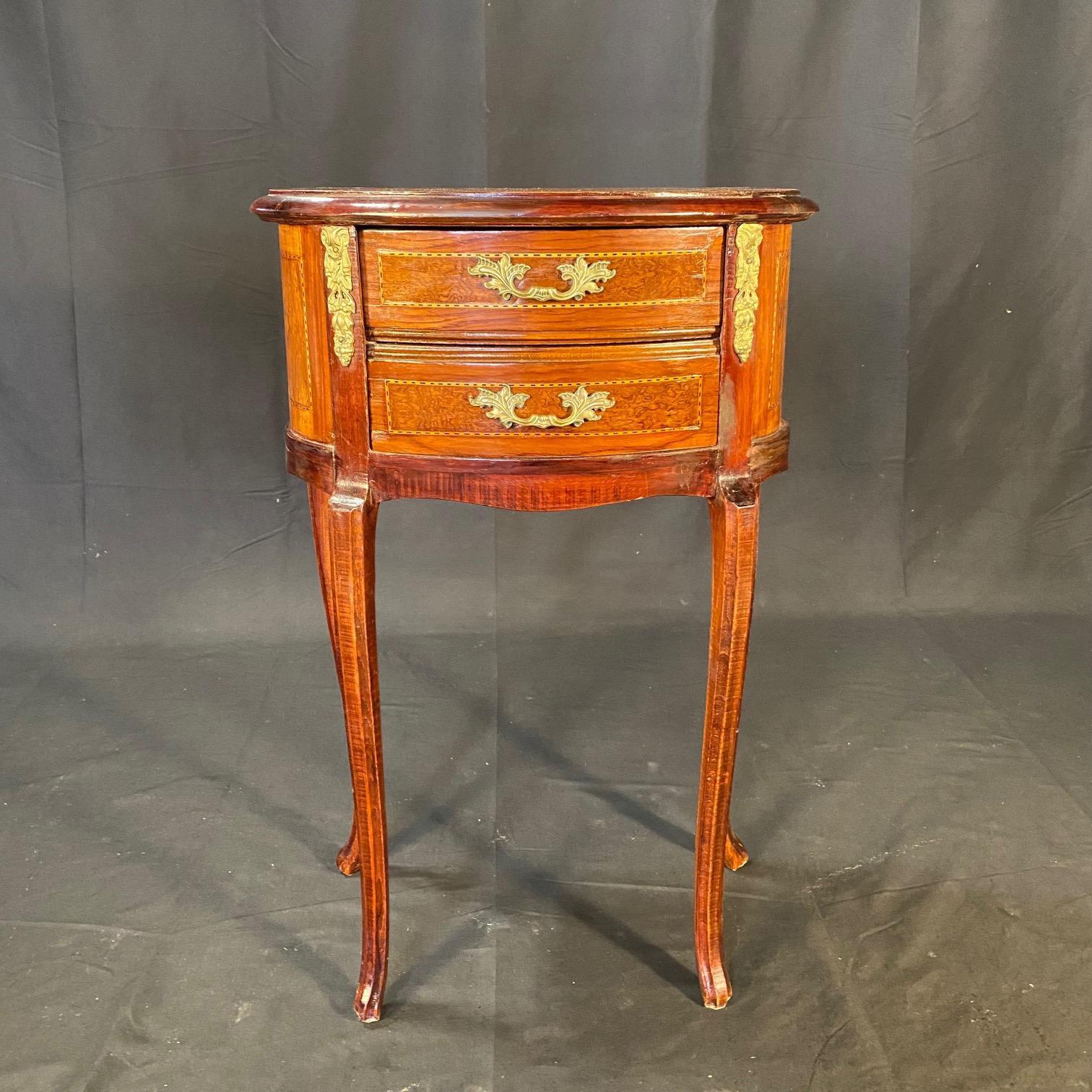 Lovely pair of French Louis XV style inlaid marquetry side tables or nightstands with ormolu accents, two dovetailed drawers and gorgeous inset rosewood top with intricate inlaid border. Will add elegance to any room in the home.  #6004
