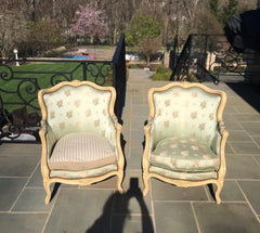 Pair of French Louis XV Painted Bergere Chairs with Beautifully Carved Flowers