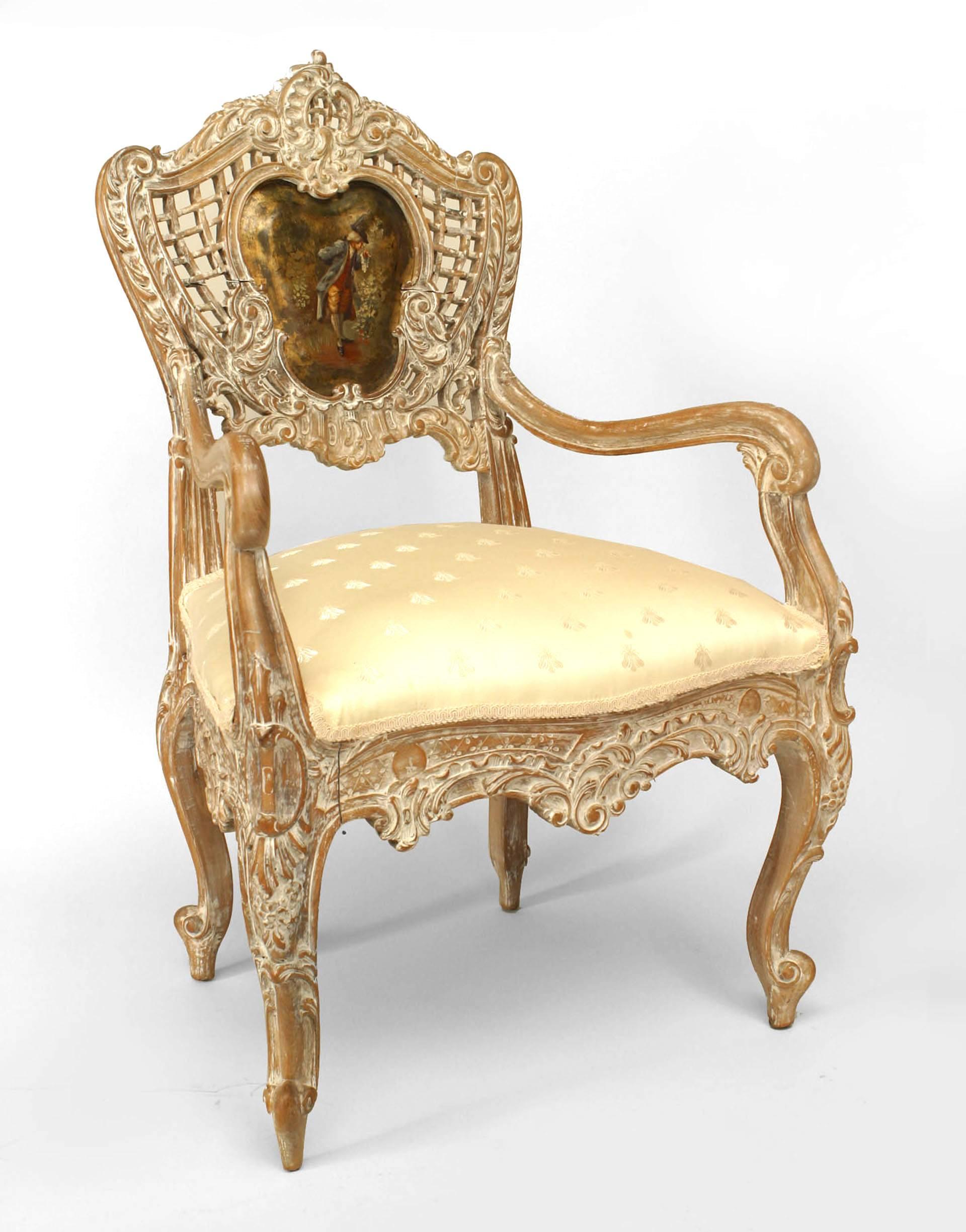 Pair of French Louis XV-style (19th Century) bleached wood armchairs with carved open lattice backs centering shaped painted panels with figural scenes and white upholstered seats. (PRICED AS Pair)
