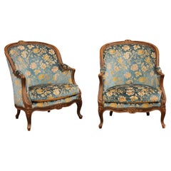 Pair of French Louis XV Style 19th Century Carved Walnut Bergères Chairs