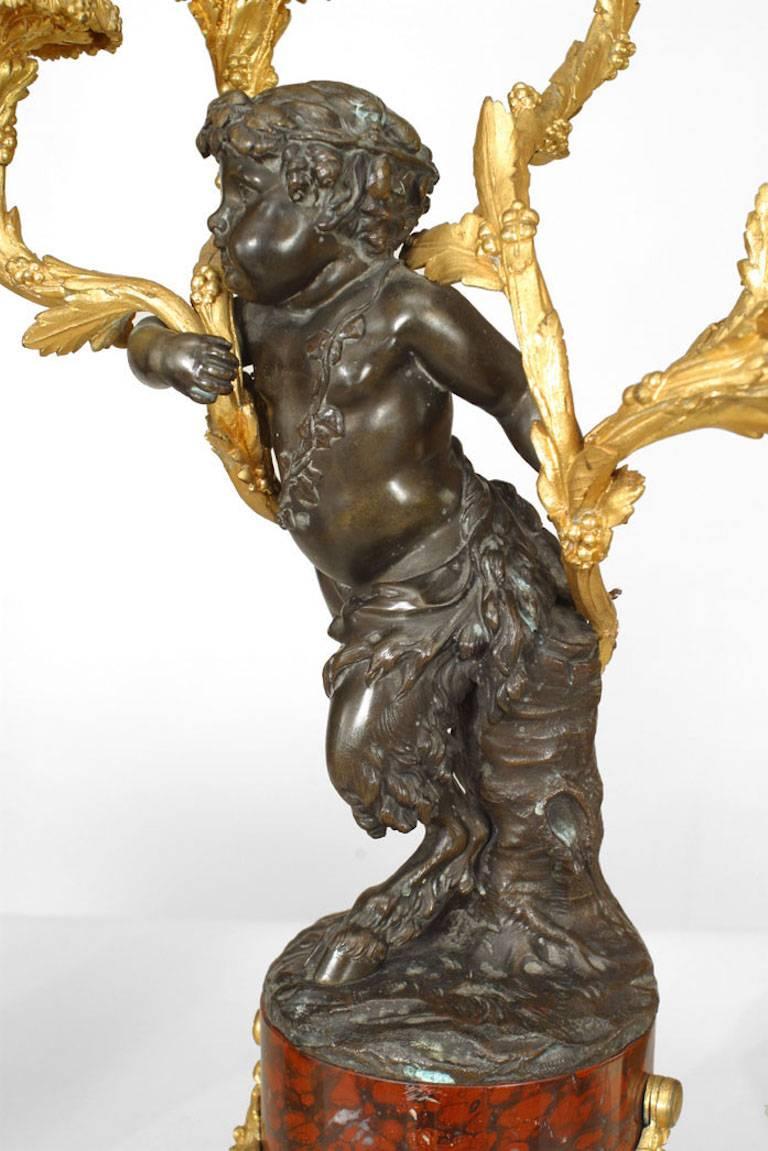Pair of French Louis XV Style Bronze with Cupid 5 Arm Candelabra on Marble Bases In Good Condition For Sale In New York, NY