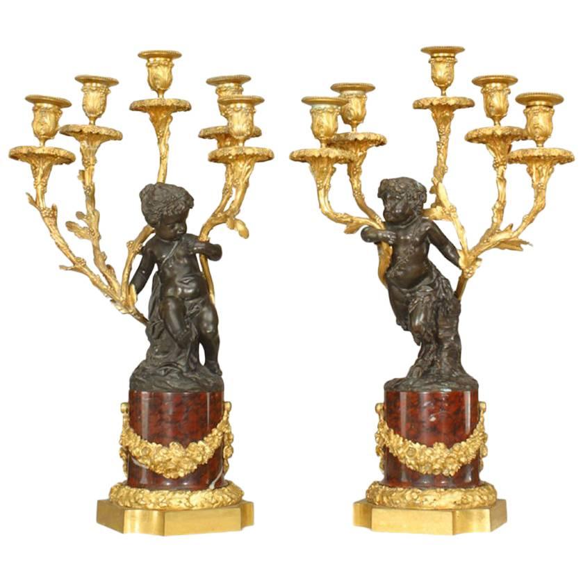 Pair of French Louis XV Style Bronze with Cupid 5 Arm Candelabra on Marble Bases For Sale
