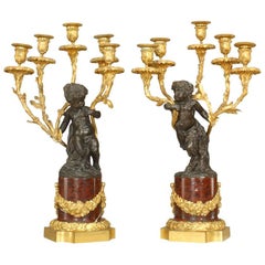 Pair of French Louis XV Style Bronze with Cupid 5 Arm Candelabra on Marble Bases