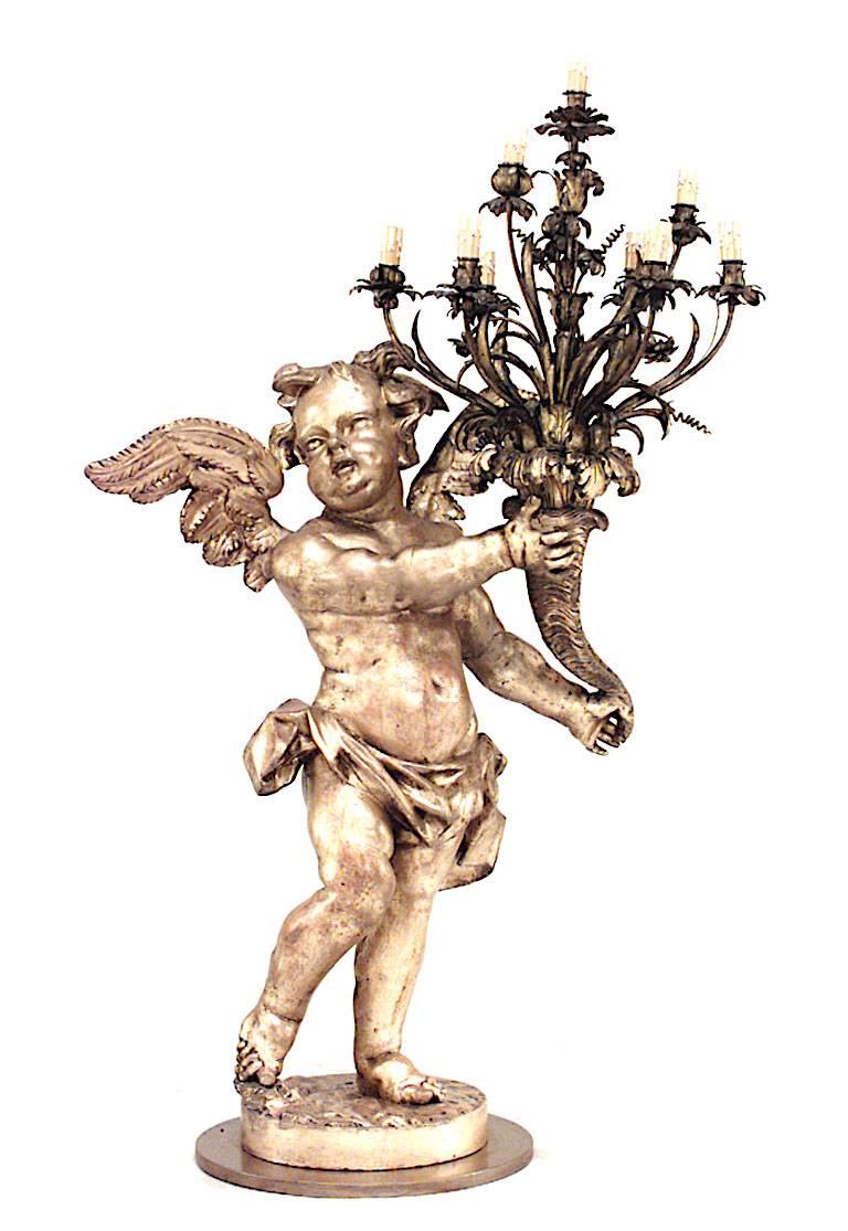 Pair of French Louis XV Style Gilt Cherub Torchieres In Good Condition For Sale In New York, NY