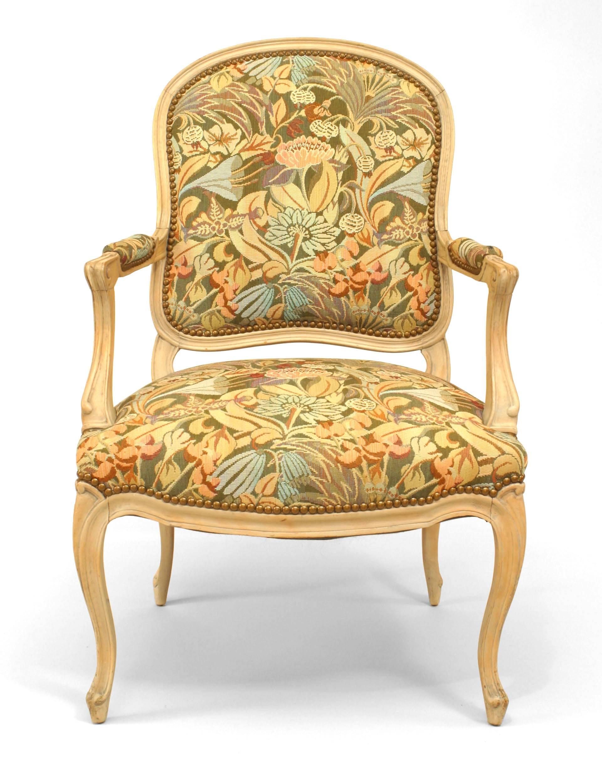 Pair of French Louis XV style (20th Cent) bleached open Armchairs with tapestry style upholstered seat and back
