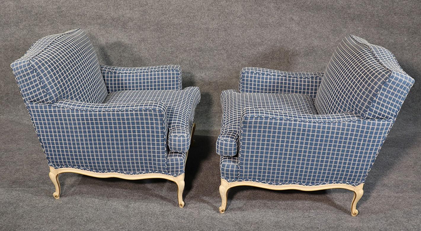 This is a fun and beautiful pair of 1950s era French Louis XV style crème painted club chairs. You don't see these very often.