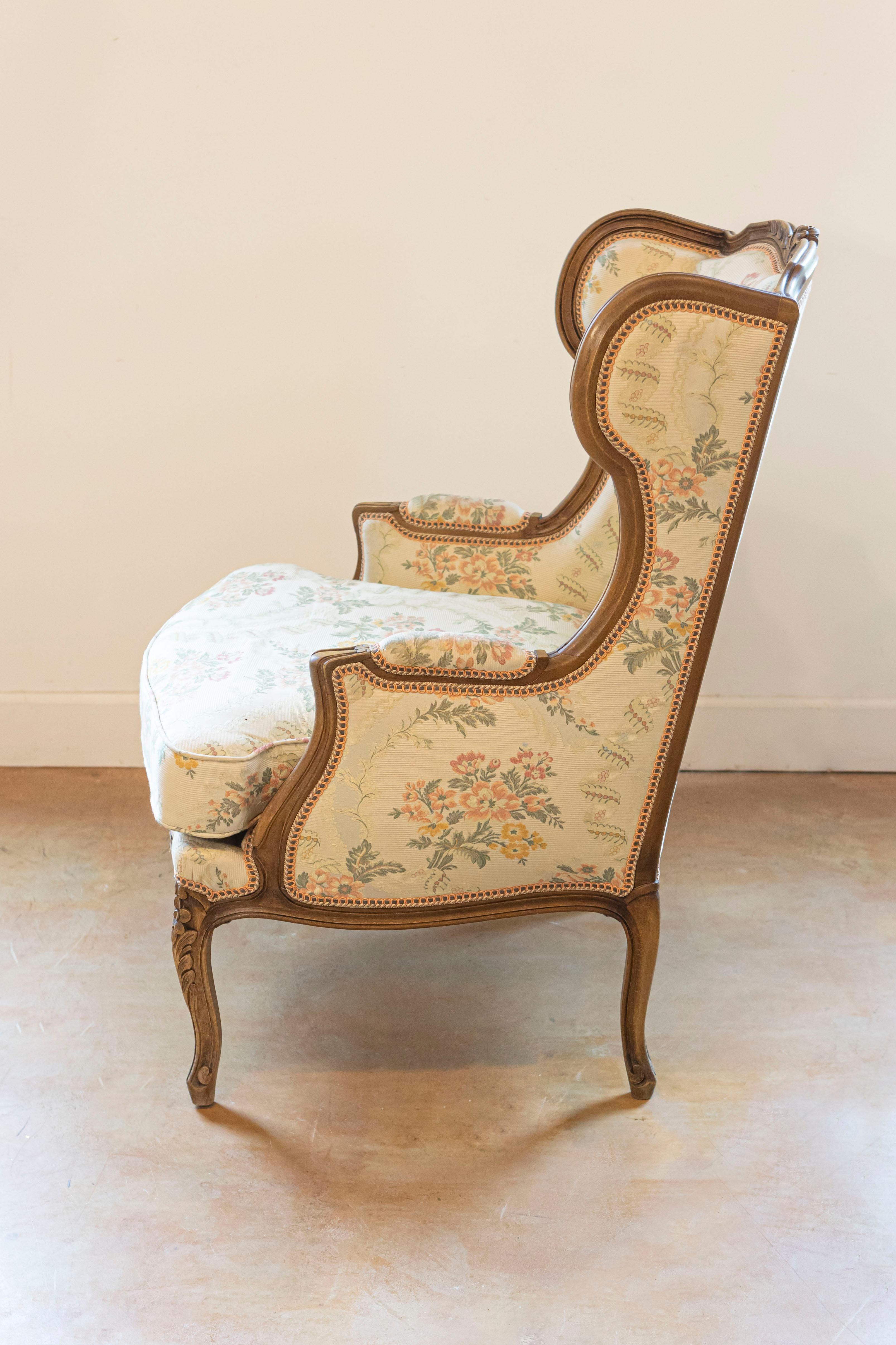 Upholstery Pair of French Louis XV Style Bergères À Oreilles with Carved Floral Décor For Sale