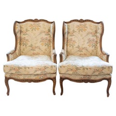 Pair of French Louis XV Style Bergères À Oreilles with Carved Floral Décor