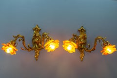 Pair of French Louis XV Style Bronze and Brown Glass Twin Arm Sconces, ca 1900