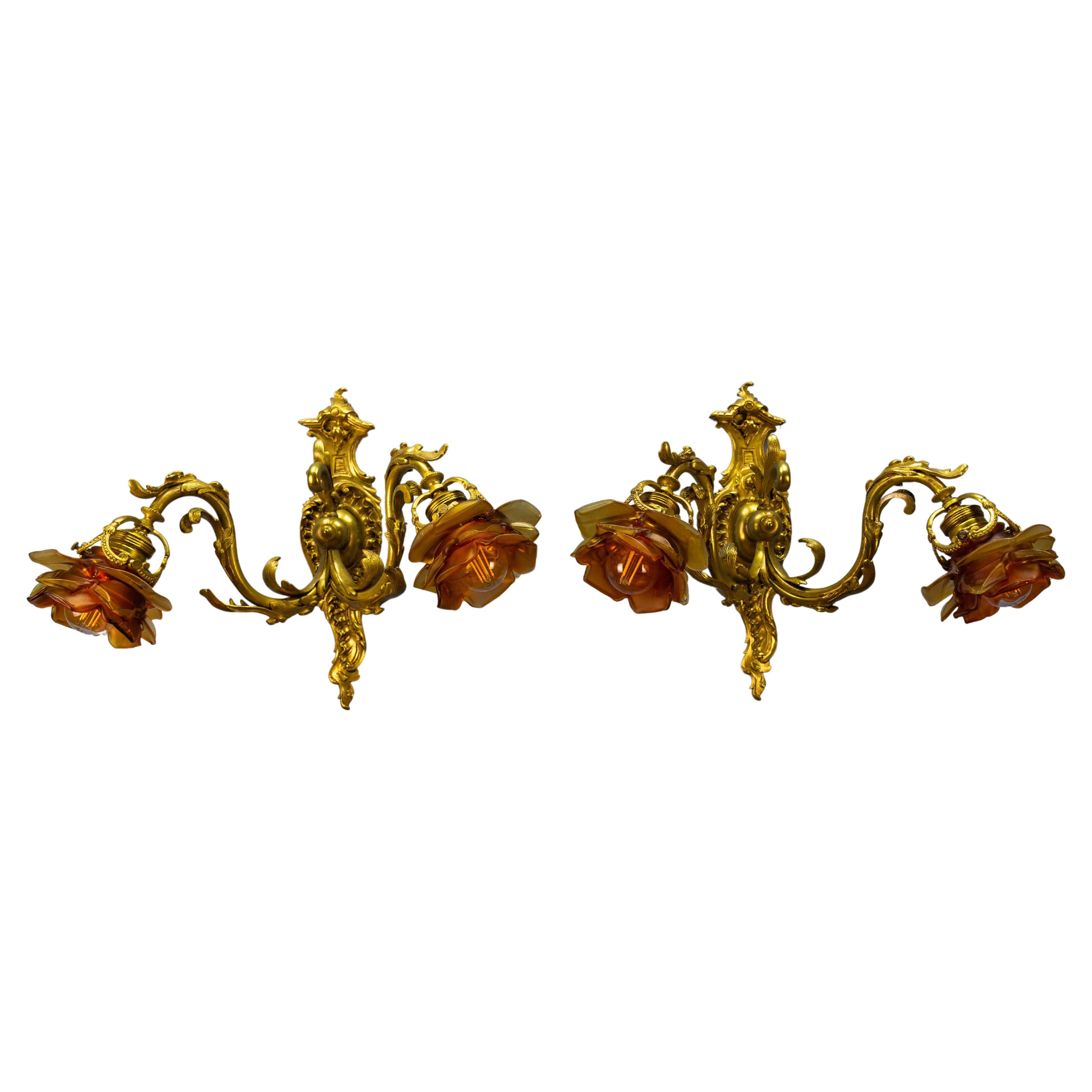 Pair of French Louis XV Style Bronze and Brown Glass Twin Arm Sconces, ca 1900 For Sale