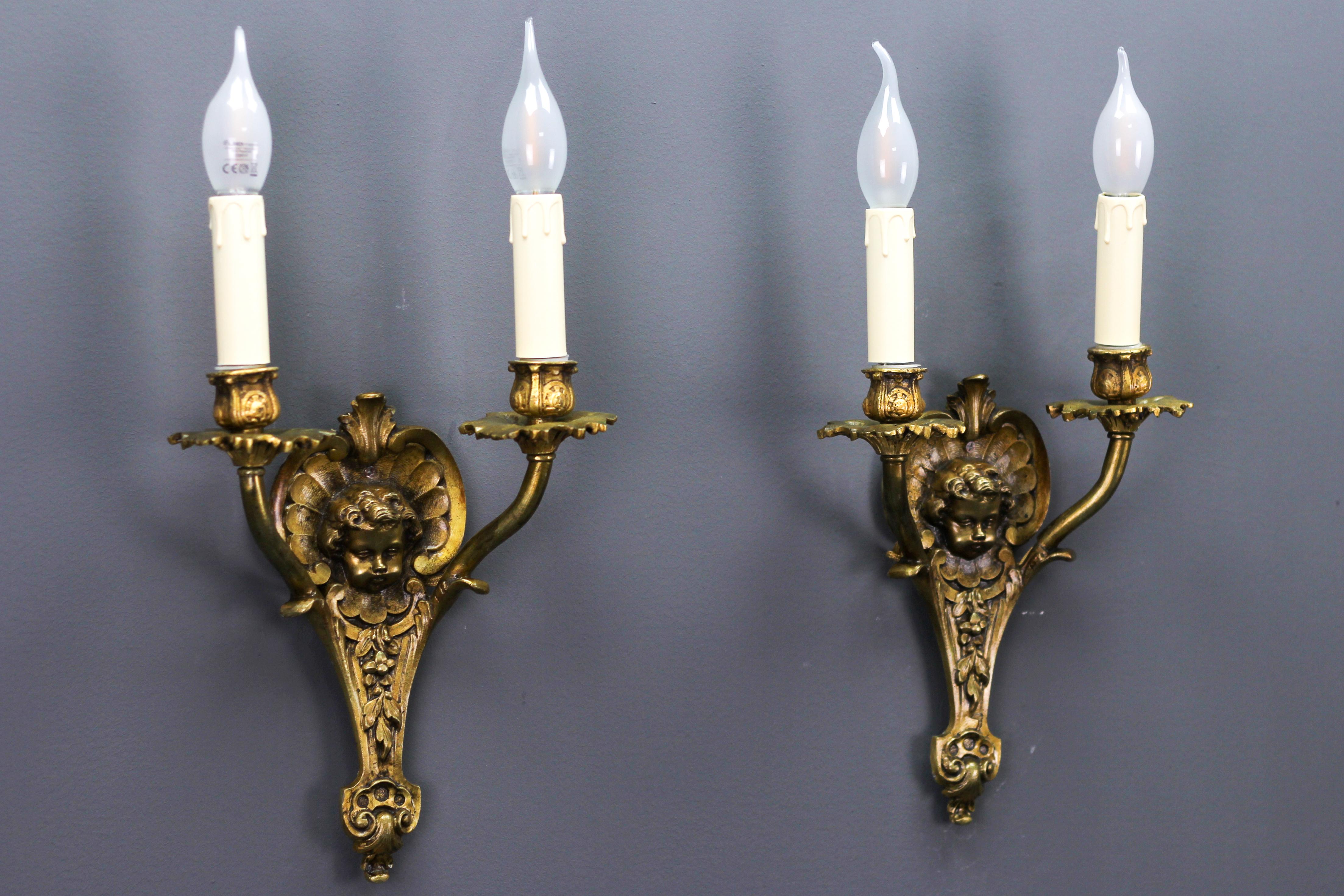 Pair of French Louis XV Style Bronze Cherubs Head Twin Arm Wall Sconces, 1930s 1