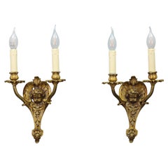 Pair of French Louis XV Style Bronze Cherubs Head Twin Arm Wall Sconces, 1930s