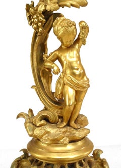 Pair of French Louis XV Style Bronze Dore Four Arm Cupid Candelabras