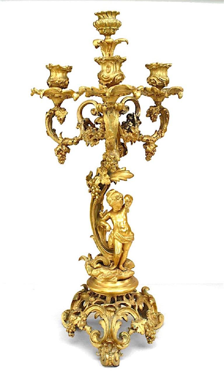 Metal Pair of French Louis XV Style Bronze Dore Four Arm Cupid Candelabras For Sale