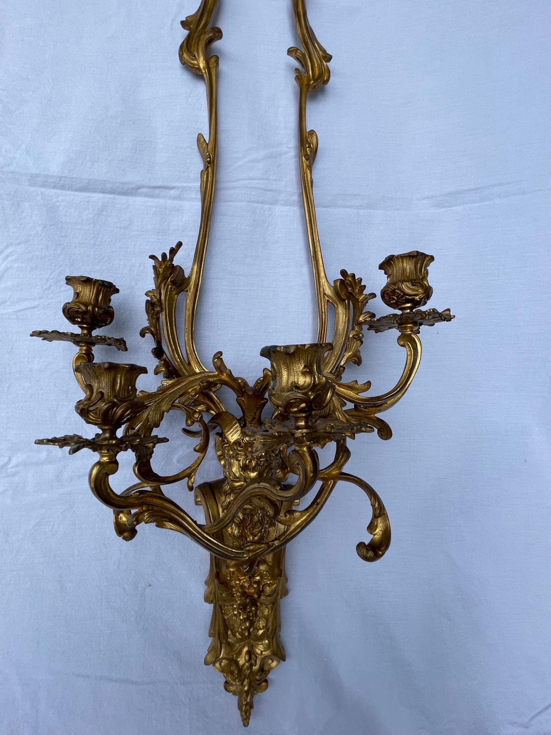 Pair of French Louis XV Style Bronze Four Light Sconces In Good Condition For Sale In Vero Beach, FL