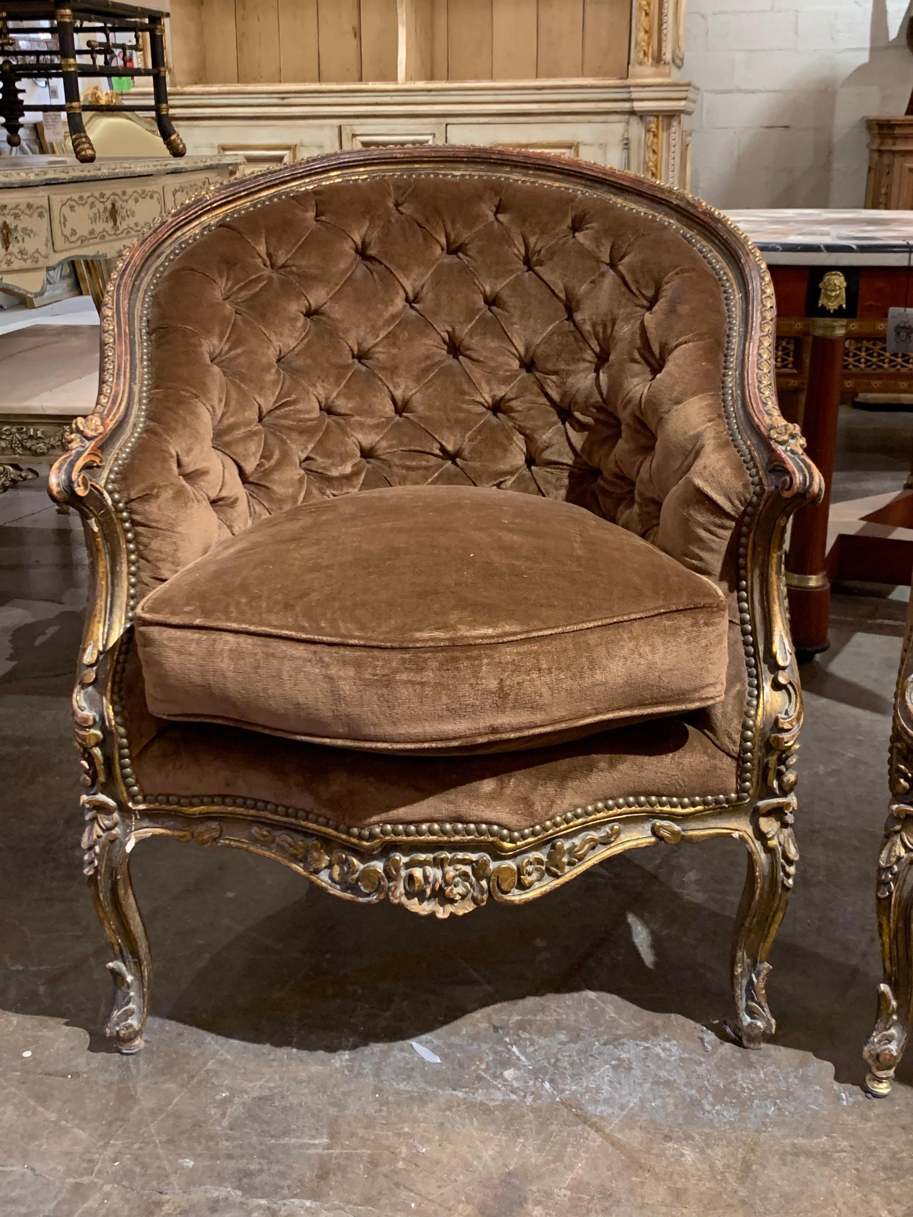 Incredible pair of French Louis XV style carved and gilded bergères upholstered in a brown velour fabric. Beautiful carvings on these! Super elegant and comfortable as well!