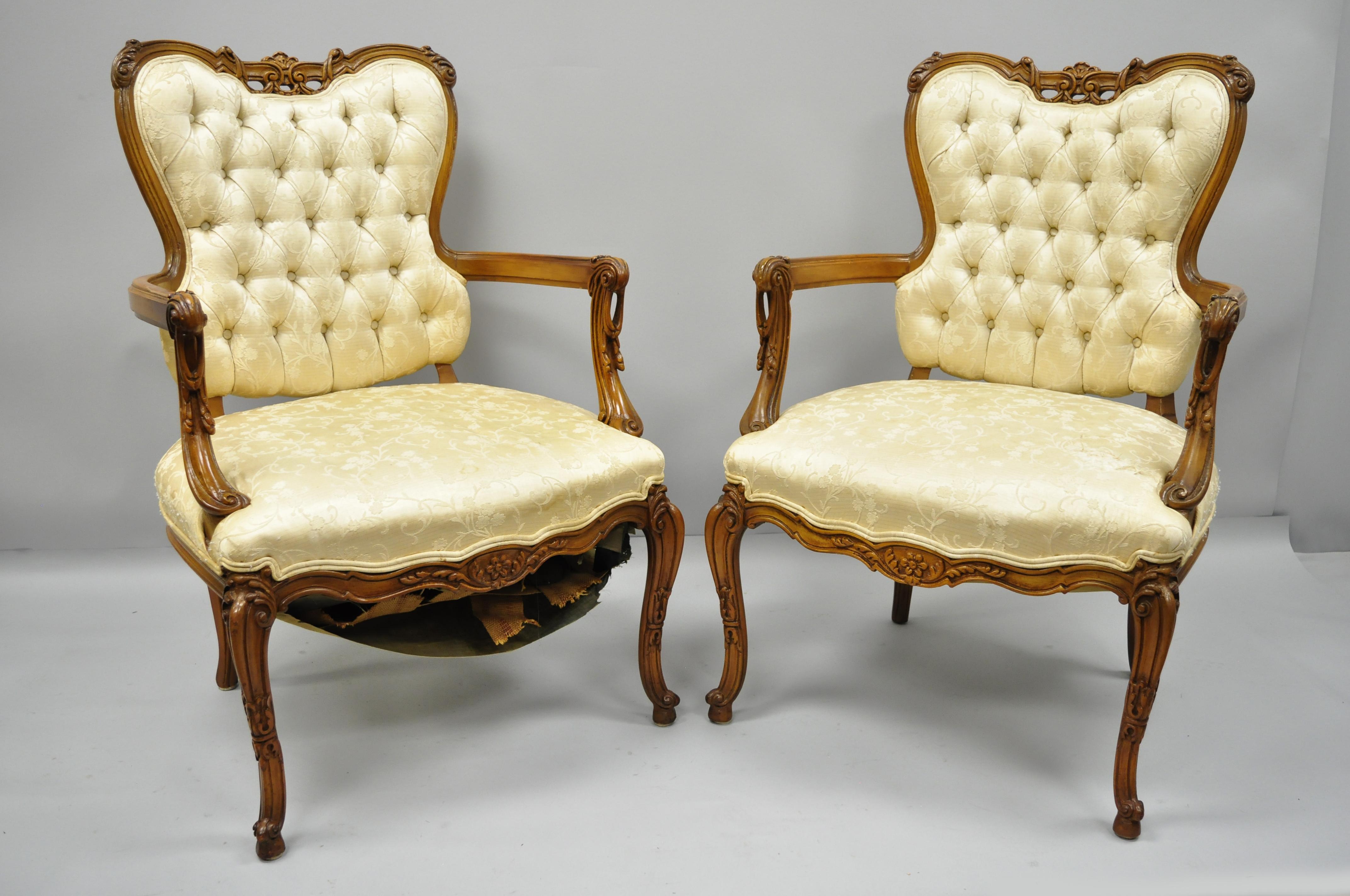 Pair of French Louis XV style carved fireside armchairs. Item features open drape carved arms, nicely carved top rail, solid wood construction, cabriole legs, and great style and form, circa early to mid-20th century. Measurements: 38